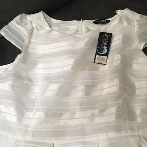 New white elegantly designed dress .